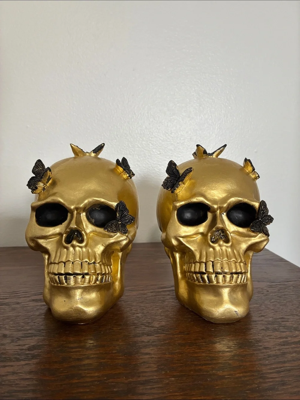 NWT- Set of 2- STUNNING- Gold Skull Statues with Black Butterflies Accents